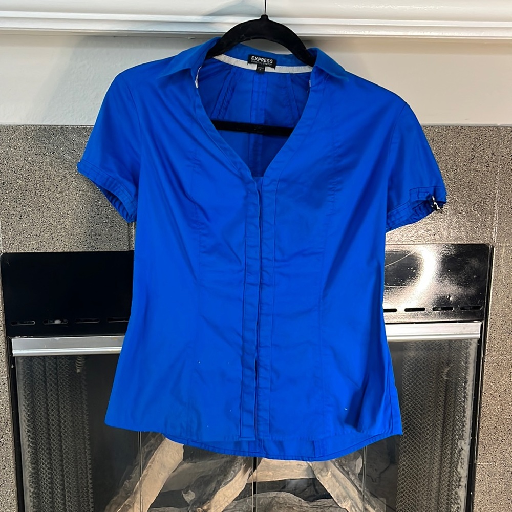 Express blue blouse with decorative buckles on sleeve